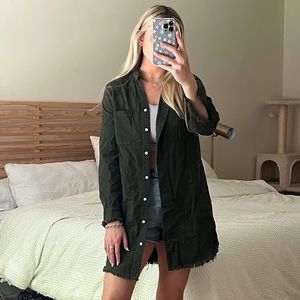 Long army green button up with frayed sleeves. Perfect closet staple!